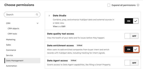 A HubSpot permissions page with 'Data Management' selected. The 'Data enrichment access' permission, a 'Critical' setting, is highlighted and shown with its toggle set to 'ON'